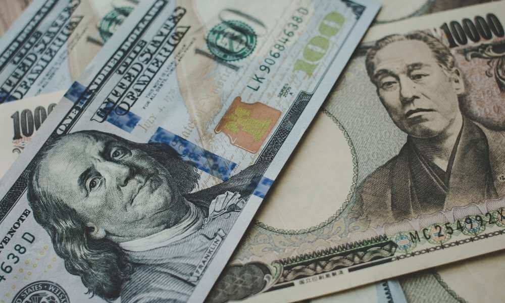 Dollar hits three-week low to yen as Fed's Powell less hawkish than feared